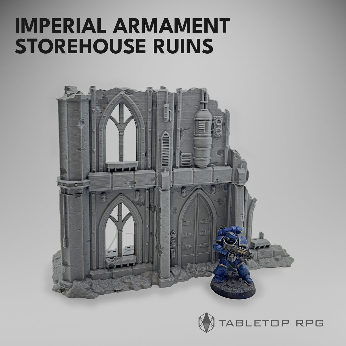 Imperial Armament Storehouse Ruins with a Space Marine at the tank facade for scale