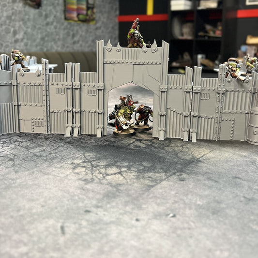 Scrap Fort locked into a closed compound, gatehouse centre, orks holding the wall at 28mm scale