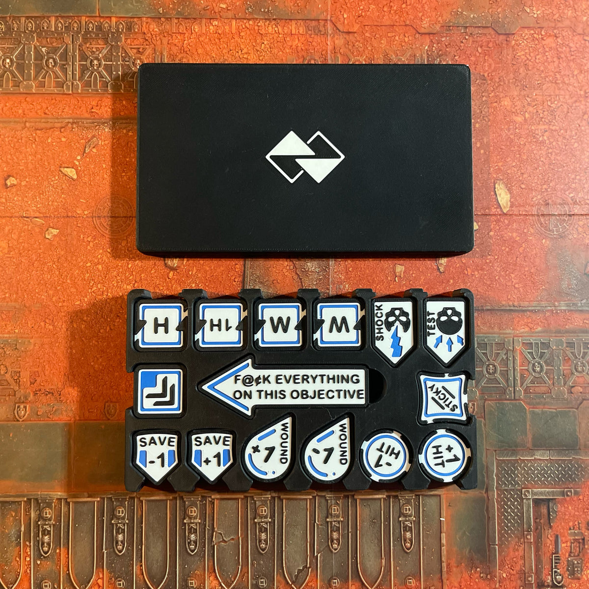 ttr-327-case-closed: closed travel case beside the loaded tray, showing how the set packs down