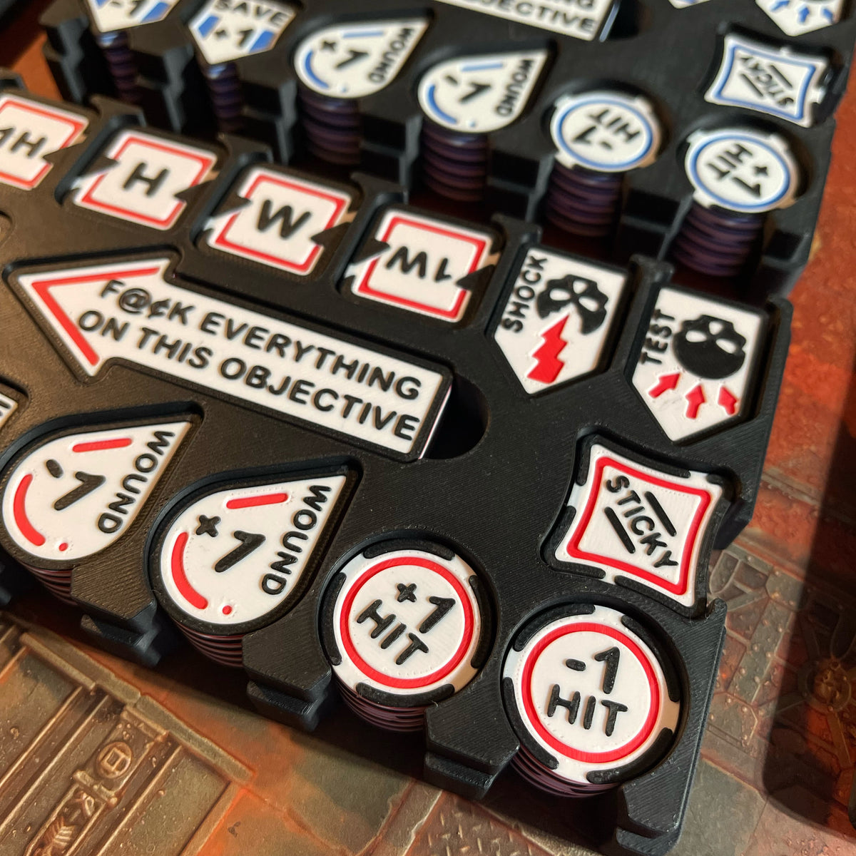 ttr-327-detail-stacks: Red and Blue token stacks in their cases, close up