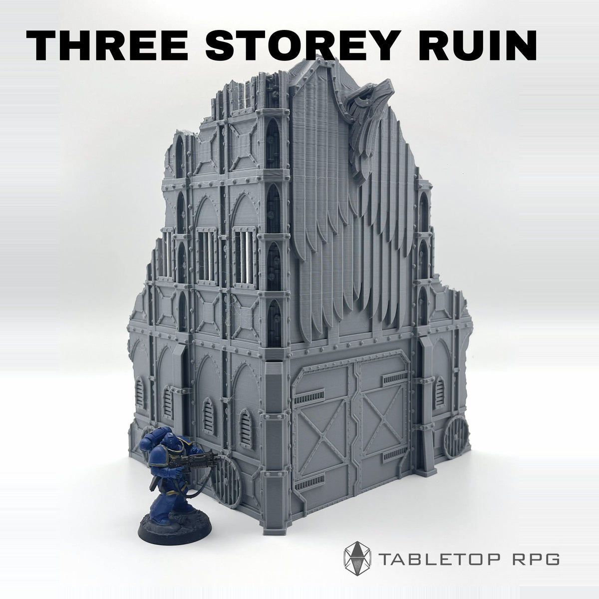 Armored ruins large three storey A shown with a miniature for scale