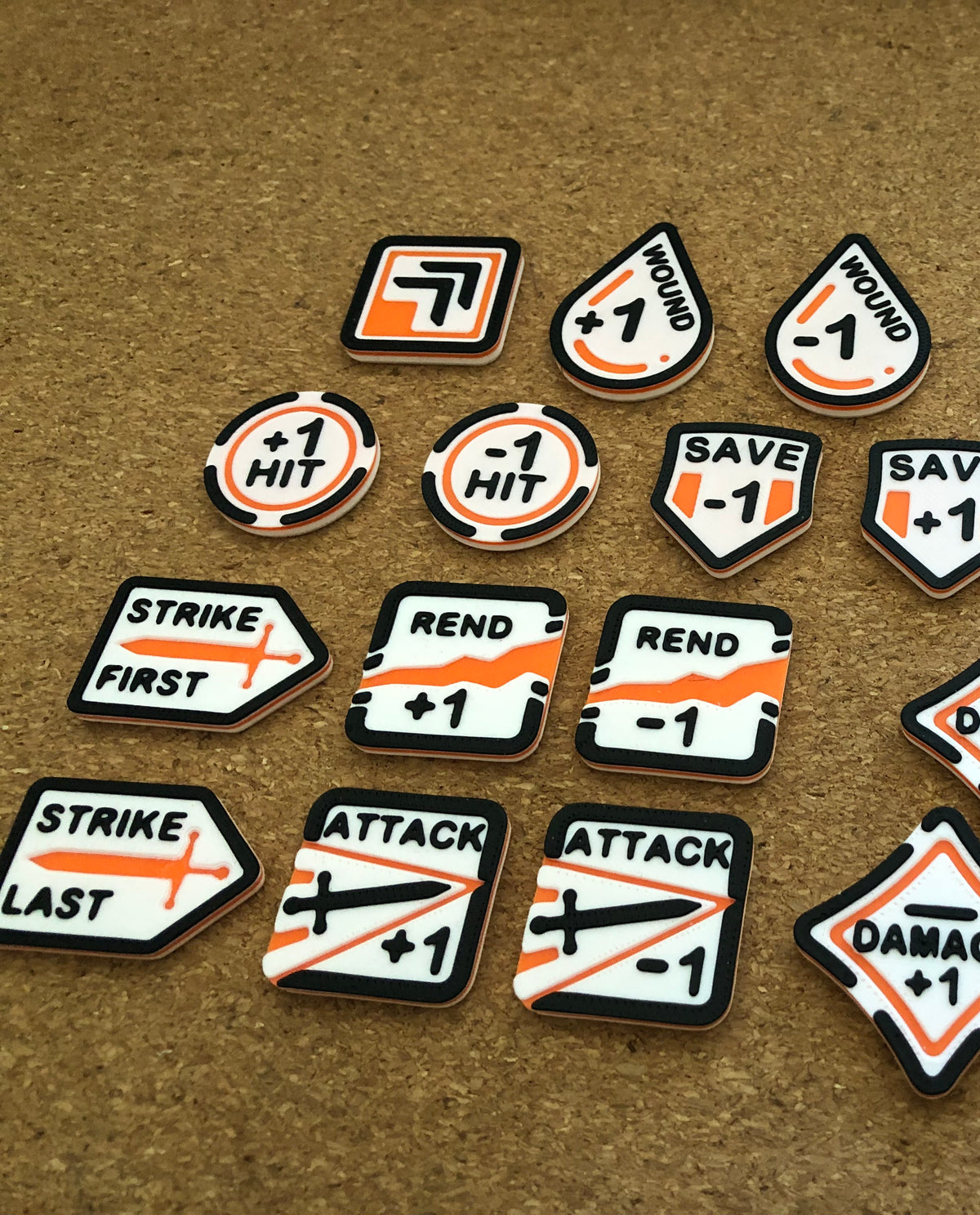 mw-328-layout — the fantasy token set laid out: Strike First/Last, Rend, Attack, Damage, Save, Hit and Wound modifiers