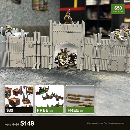 The Huuuuge Modular Scrap Fort set up as a walled compound with orks on the parapet, with the Scrap Wasteland Outpost and the free Scrap Barricades and Modular Sandbags shown alongside it. $199 of terrain for $149.