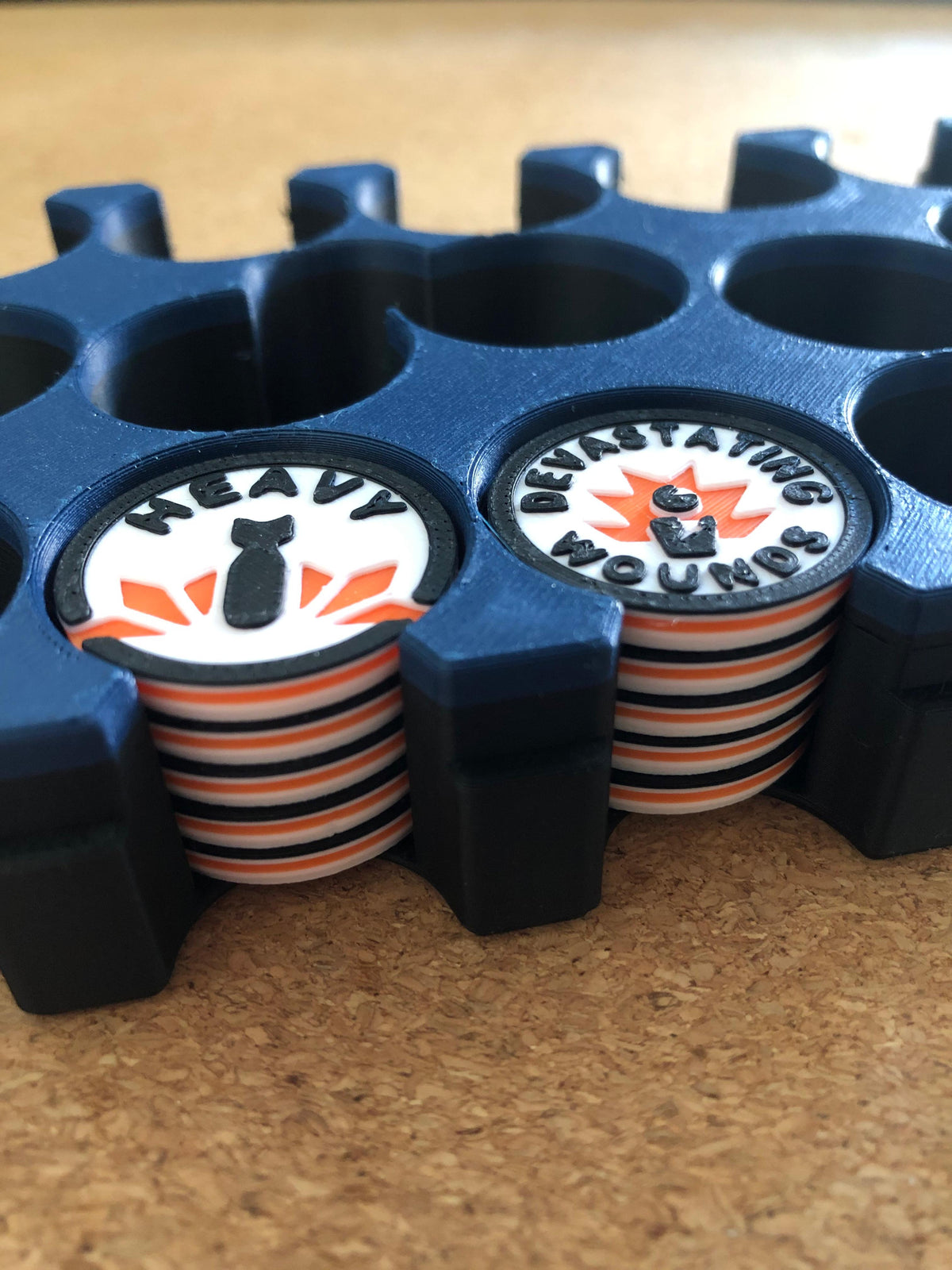 mw-329-case — travel case holding stacks of Heavy and Devastating Wounds tokens
