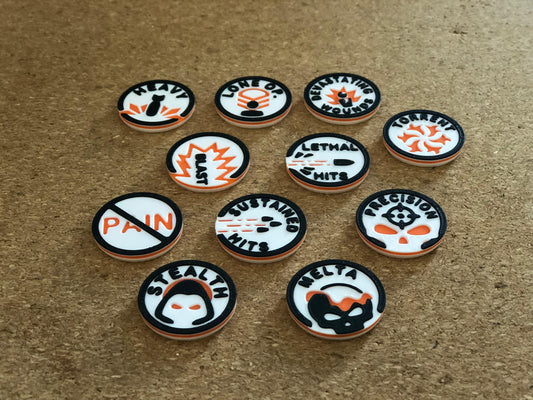 mw-329-layout — weapon ability tokens laid out: Heavy, Lone Operative, Devastating Wounds, Torrent, Lethal Hits, Precision, Sustained Hits, Stealth, Melta, Feel No Pain, Blast